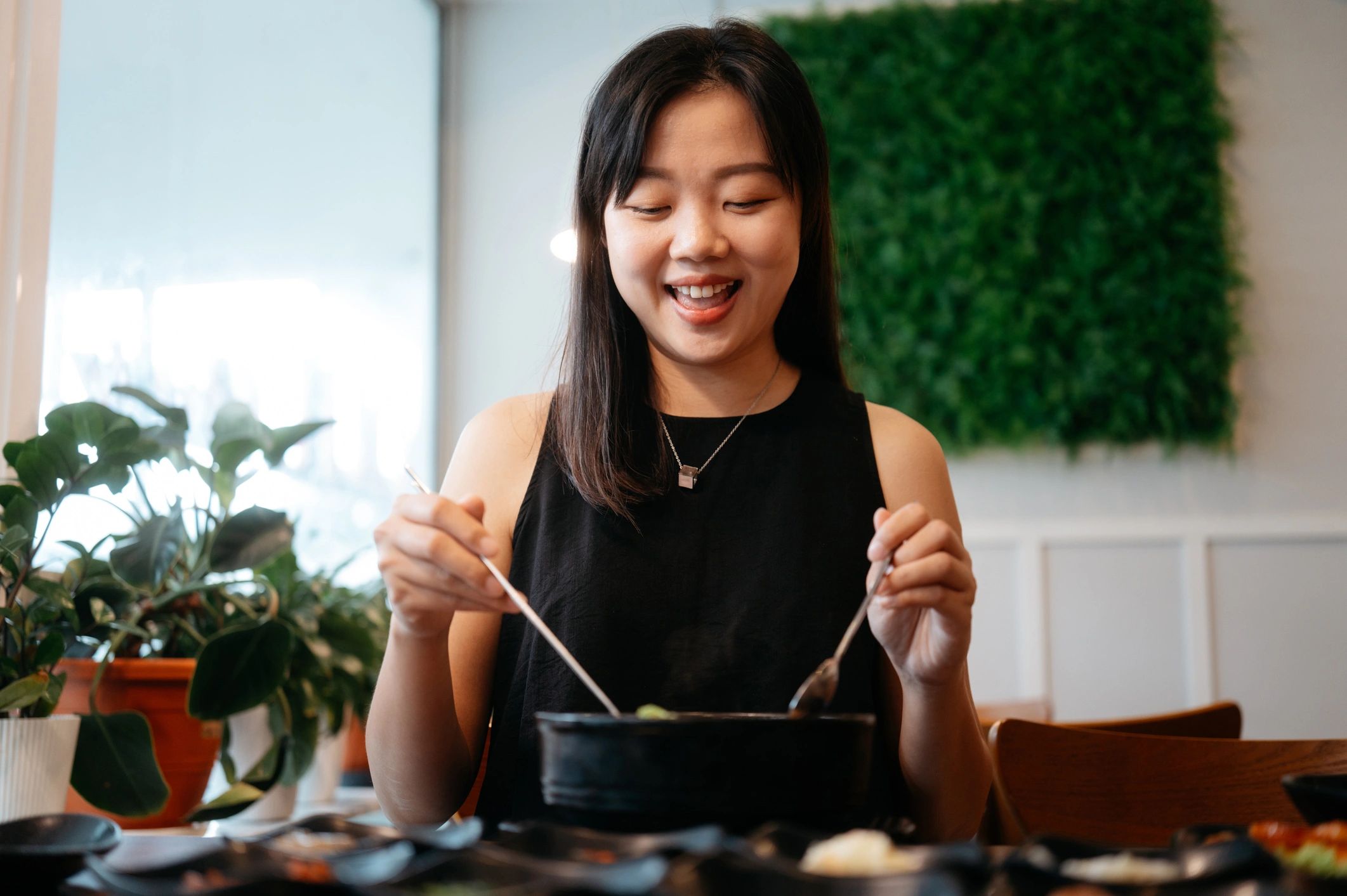 Happy diner enjoying a flavourful rice meal
